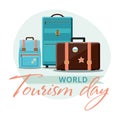 World Tourism Day, 27 September. Travel suitcases with stickers.